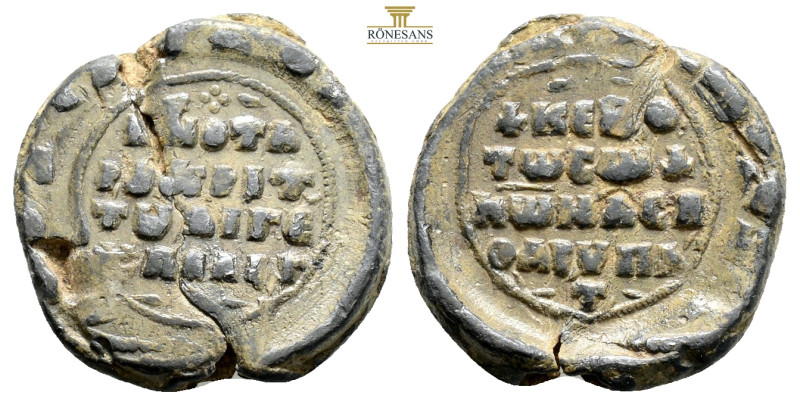 BYZANTINE LEAD SEAL. 7,6 g. 23,1 mm. 11th century. 
Obv. Legend in Four lines....