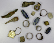MOMBASA: LOT of 17 items, including 5 rings, 4 beads, 1 hand charm, and 7 other objects (no coins); probably all 18th-20th century; lot of 17 items.
...