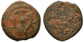 JUDAEA. Hasmoneans. John Hyrkanos I (Yehohanan). 135-104 BC. Prutah (bronze, 1.70 g, 13 mm), Jerusalem. Legend within wreath. Rev. Splayed double corn...