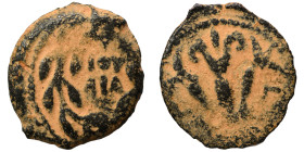 JUDAEA. Procurators. Valerius Gratus, 15-26. Prutah (bronze, 1.80 g, 17 mm), Jerusalem. IOY/ΛIA in two lines within wreath tied at the top. Rev. Three...