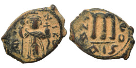 Constans II, 641-668. Follis (bronze, 5.00 g, 22 mm), Constantinople. EN T૪TO NIKA Constans II , beardless, standing facing, wearing crown surmounted ...