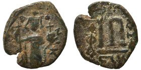 Constans II, 641-668. Follis (bronze, 3.30 g, 22 mm), Constantinople. EN T૪TO NIKA Constans II standing facing, wearing crown surmounted by cross, hol...