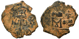 Constans II, with Constantine IV, Heraclius, and Tiberius, 641-668. Follis (bronze, 4.49 g, 24 mm), Constantinople. Helmeted bust of Constans facing, ...