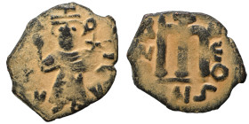Arab Byzantine. Umayyad Caliphate, circa 641-660 AD. Fals (bronze, 3.23 g, 22 mm). Pseudo-Byzantine type, imitating the types of Constans II. Standing...