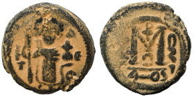Arab Byzantine. Umayyad Caliphate, circa 641-660 AD. Fals (bronze, 4.98 g, 17 mm). Pseudo-Byzantine type, imitating the types of Constans II. Standing...