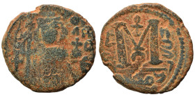 Arab Byzantine. Umayyad Caliphate, circa 641-660 AD. Fals (bronze, 3.11 g, 16 mm). Pseudo-Byzantine type, imitating the types of Constans II. Standing...