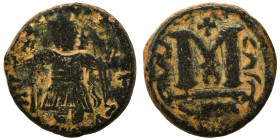 Arab Byzantine. Umayyad Caliphate, circa 641-660 AD. Fals (bronze, 4.86 g, 18 mm). Pseudo-Byzantine type, imitating the types of Constans II. Standing...