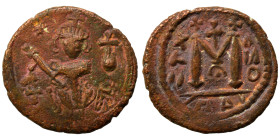 Arab Byzantine. Umayyad Caliphate, circa 641-660 AD. Fals (bronze, 3.96 g, 19 mm). Pseudo-Byzantine type, imitating the types of Constans II. Standing...