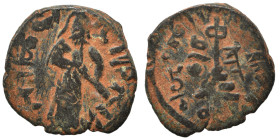Umayyad Caliphate. al-Malik ibn Marwan, AH 65-86 / 685-705 AD. Fals (bronze, 2.53 g, 19 mm), 'Standing Caliph' type. Caliph standing facing, bearded, ...