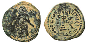 Umayyad Caliphate. al-Malik ibn Marwan, AH 65-86 / 685-705 AD. Fals (bronze, 3.47 g, 21 mm), 'Standing Caliph' type. Caliph standing facing, bearded, ...