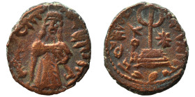 Umayyad Caliphate. al-Malik ibn Marwan, AH 65-86 / 685-705 AD. Fals (bronze, 3.65 g, 18 mm), 'Standing Caliph' type. Caliph standing facing, bearded, ...