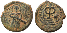 Umayyad Caliphate. al-Malik ibn Marwan, AH 65-86 / 685-705 AD. Fals (bronze, 3.48 g, 18 mm), 'Standing Caliph' type. Caliph standing facing, bearded, ...