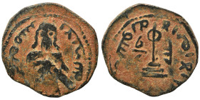 Umayyad Caliphate. al-Malik ibn Marwan, AH 65-86 / 685-705 AD. Fals (bronze, 3.04 g, 19 mm), 'Standing Caliph' type. Caliph standing facing, bearded, ...