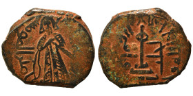 Umayyad Caliphate. al-Malik ibn Marwan, AH 65-86 / 685-705 AD. Fals (bronze, 2.86 g, 19 mm), 'Standing Caliph' type. Caliph standing facing, bearded, ...