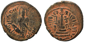 Umayyad Caliphate. al-Malik ibn Marwan, AH 65-86 / 685-705 AD. Fals (bronze, 2.88 g, 18 mm), 'Standing Caliph' type. Caliph standing facing, bearded, ...