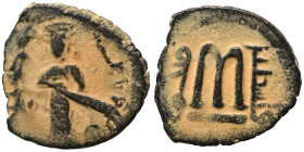 Umayyad Caliphate. al-Malik ibn Marwan, AH 65-86 / 685-705 AD. Fals (bronze, 2.26 g, 17 mm), 'Standing Caliph' type, unidentified mint in Jund Filasti...