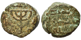 Umayyad Caliphate, circa 695-750. Fals (bronze, 3.84 g, 13 mm), Jerusalem. Menorah, Arabic legend around. Rev. legend in three lines. Nearly very fine...