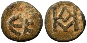 Lead token (?), circa 6th-7th centuries, (lead, 3.60 g, 16 mm), uncertain mint. Monogram. Rev. EK. Very fine. Rare.