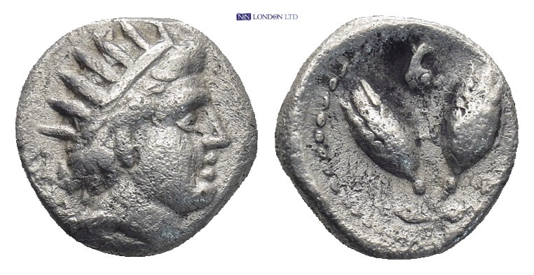 Caria, Rhodes. AR Diobol, Circa 229-205 BC. 0.93 Gr. 9mm.
Radiate head of Helios...