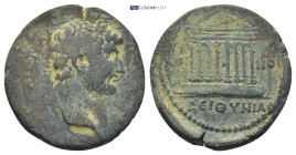 KOINON of BITHYNIA. Hadrian. AD 117-138. Æ (21mm, 6.64 g). Laureate head right / KOI-NON across field, BEIΘYNIAC below, , octastyle temple; wolf and t...