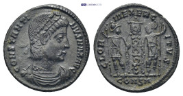 Constantine I AD 330-333. Nummus. Constantinople 1.7 Gr. 16mm.
Diademed, draped and cuirassed bust right 
Rev. Two soldiers helmeted, standing facing ...
