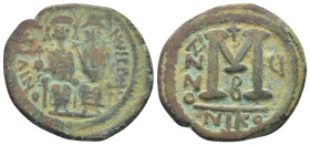 Justin II and Sophia AD 565-578. Dated RY 6=AD 570/1. Nikomedia Follis Æ (29mm, 13.8 g). Nimbate figures of Justin and Sophia seated facing on double ...