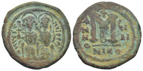 Justin II and Sophia AD 565-578. Regnal Year 9=AD 573/4. Nikomedia Follis Æ (29mm, 13.1 g). Justin and Sophia seated facing on double-throne, each hol...