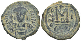 Maurice Tiberius (582-602). Æ 40 Nummi (29mm, 14.0 g). Constantinople. Helmeted and cuirassed bust facing, holding globus cruciger. R/ Large M, cross ...