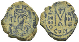 Maurice Tiberius. 582-602. AE follis (26mm, 10.8 g). Constantinople, 594-595. DN MAVRC TIbER PP AVG, helmeted and cuirassed facing bust, holding globu...