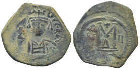 Maurice Tiberius. 582-602. AE Follis (28mm, 11.7 g). A.D. 589/90. Helmeted and cuirassed bust facing holding globus cruciger and shield / Large M betw...