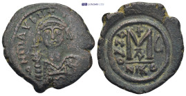 Maurice Tiberius. AD 582-602. Nikomedia Follis AE. 10.7 Gr. 28mm.
Helmeted and cuirassed or crowned and cuirassed bust facing, holding cross on globe ...