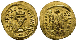 Phocas, 602-610. Solidus Constantinople. 4.43 Gr. 22mm.
Draped and cuirassed bust of Phocas facing, wearing crown and holding a globus cruciger in his...
