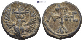 Byzantine Lead Seal (11.44 Gr. 21mm.). Obv: Eagle standing facing, head right, wings spread, cruciform monogram. Rev: Cruciform monogram.