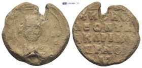 Byzantine Lead Seal (11.23 Gr. 25mm.). Obv: Bust of a Saint Rev: Legends in four lines.