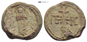 Byzantine Lead Seal (15.42 Gr. 23mm.). Obv: Saint standing facing. Rev: Cruciform monogram