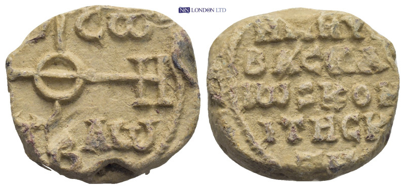 Byzantine Lead Seal (16.55 Gr. 23mm.). Obv: Cruciform monogram Rev: Legends in f...