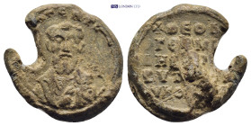 Byzantine Lead Seal (19mm, 6.58 g) Obv: Bust of a bearded male figure. Rev: Legends in five lines.