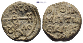 Byzantine Lead Seal (19mm, 8.99 g) Obv: Cruciform monogram Rev: Legends in three lines.