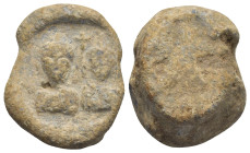 Byzantine Lead Seal (22mm, 21.6 g) Obv: Two draped male busts facing; between their heads, cross. Rev: Blank