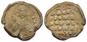 Byzantine Lead Seal (23mm, 8.12 g) Obv: Nimbate facing bust of Saint, holding spear over his right shoulder and resting shield on his left arm. Rev: L...