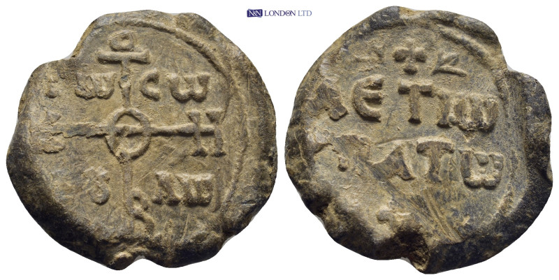 Byzantine Lead Seal (28mm, 15.4 g) Obv: Cruciform monogram Rev: Legends in three...