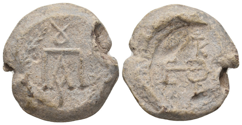 UNCERTAIN (Circa 5th-6th centuries). Lead Seal.
Obv: Monogram.
Rev: Cruciform in...