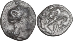 Greek Italy. Southern Apulia, Tarentum. AR Diobol, 325-280 BC. Obv. Head of Athena right, wearing helmet decorated with Scylla. Rev. Herakles kneeling...