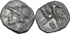 Greek Italy. Southern Apulia, Tarentum. AR Diobol, 280-228 BC. Obv. Helmeted head of Athena left. Rev. Herakles standing with knee on lion left and br...