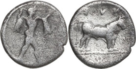Greek Italy. Lucania, Poseidonia-Paestum. AR Diobol, 445-420 BC. Obv. Poseidon striding right, cloak hanging from shoulders, brandishing trident. Rev....