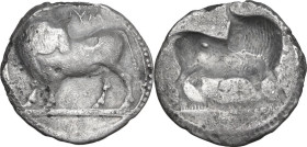 Greek Italy. Southern Lucania, Sybaris. AR Nomos, c. 530-510 BC. Obv. Bull standing left on dotted ground line, head turned back; above, YM. Rev. Incu...