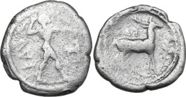 Greek Italy. Bruttium, Kaulonia. AR Drachm, 475-425 BC. Obv. Apollo striding right, brandishing branch; to right, stag. Rev. Stag right; to right, lau...