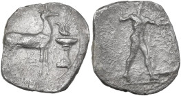 Greek Italy. Bruttium, Kaulonia. AR Stater, 425-420 BC. Obv. Apollo striding right, brandishing laurel branch. Rev. Stag standing right; to right, bir...