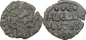 Theophilus (829-842). AE Follis, Constantinople mint, 931-944 AD. Obv. Crowned half-length figure facing, wearing loros, holding labarum and globus cr...