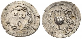 Judaea, Bar Kokhba Revolt. Silver Zuz (3.11 g), 132-135 CE. Year 2 (133/4 CE). 'Sm' (Paleo-Hebrew) within wreath of thin branches wrapped around eight...